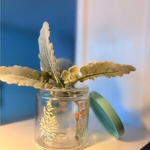 Vintage decorative glass jar with teal lid